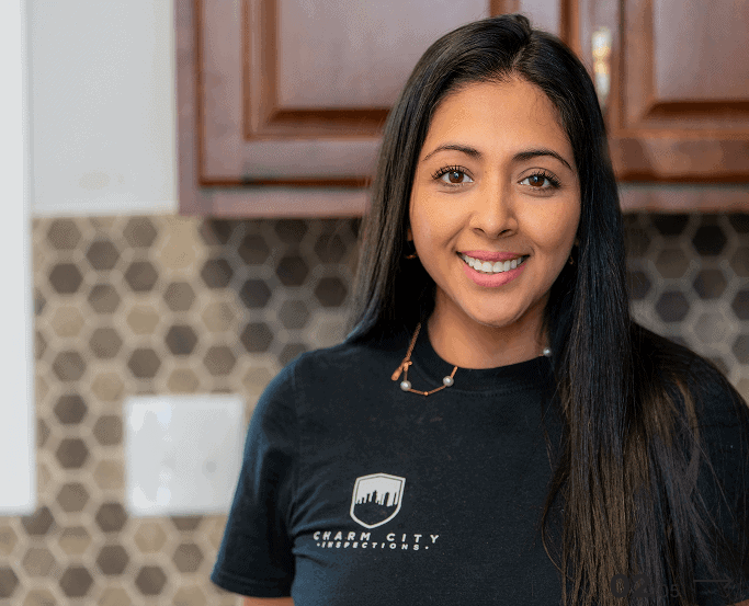 A Charm City Inspections inspector smiling in a kitchen